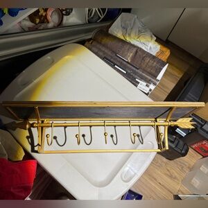 Gold and Wood Wall-Mounted Shelf With Hooks